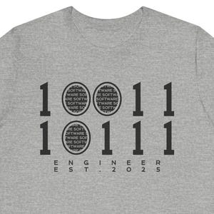 May include: Gray t-shirt with a graphic design of the numbers 1011111 and the text "ENGINEER EST. 2025".