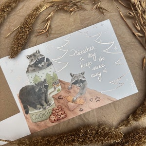 Weihnachtskarte Waschbär backend Waschbären Kekse Plätzchen rosegold Weihnachten moni goes wild Waldtier Weihnachtsbäckerei Plätzchen