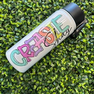 May include: White water bottle with a black lid and a colorful graphic that says "Create & Love" with a signature underneath.