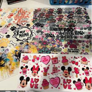 a table topped with lots of different types of stickers