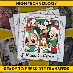 May include: A stack of ready-to-press DTF transfers featuring a Christmas design with Mickey Mouse, Minnie Mouse, Donald Duck, Goofy, and Pluto. The design is framed with Christmas lights and the words "Merry Christmas" are written below. The words "High Technology" and "Ready to Press DTF Transfers" are also visible.