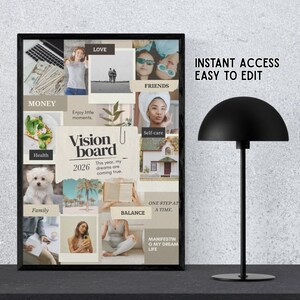 May include: A framed vision board with a black frame, featuring images and text related to goals and aspirations. The board includes the text "Vision Board 2026" and phrases like "Love," "Friends," and "Self-care." A black desk lamp is on the right.