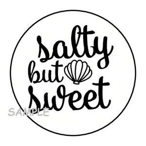May include: A white circle with black text that reads "salty but sweet" with a seashell graphic in the middle.