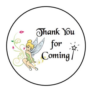 May include: Round sticker with a green fairy with yellow hair and wings. The fairy is sitting on a green leaf with a pink flower. The sticker says "Thank You for Coming" with a gold star wand.