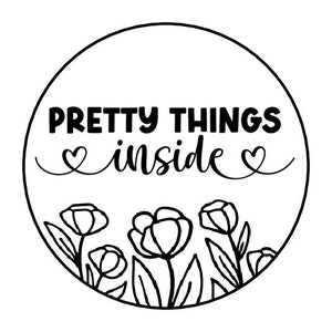 May include: Black and white illustration of a circle with the text "PRETTY THINGS inside" and a floral design around the edge.