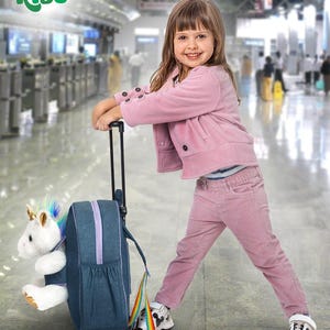 May include: A young girl in a pink outfit stands with a rolling suitcase. The suitcase is denim blue with a rainbow pull and a stuffed unicorn. The image has the text "Naturally Kids" in the upper left corner.