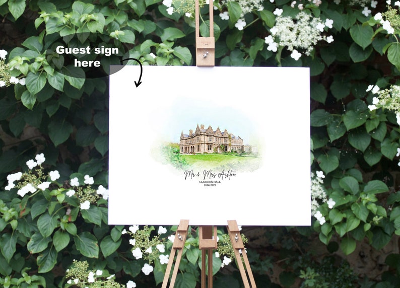 May include: A white sign on a wooden easel, featuring a watercolor painting of a stately building. The sign reads "Mr & Mrs Ashton" and "Clarendon Hall 10.06.2023". The words "Guest sign here" are also visible.