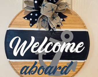 Welcome aboard sign. Nautical boat house door decor. Navy blue with anchor and starfish bow. Coastal wreath entryway door hanger.