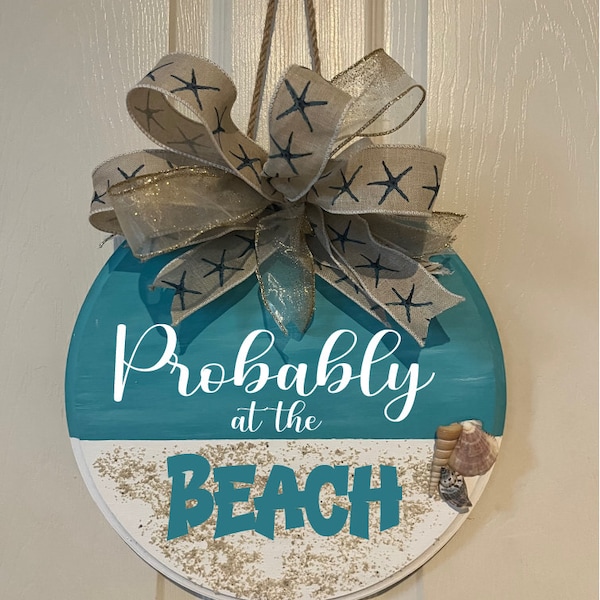 Probably at the beach door decor with real beach sand and shells. Beach house welcome sign. Life is better at the beach wreath.