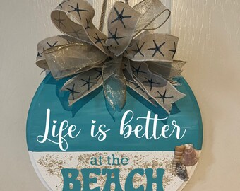 Life is better at the beach front door decor. Beach house door sign. Coastal beach wreath door hanger. Made with real beach sand and shells.