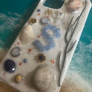 Personalized seascape beach inspired phone case. Each case is individually handmade using real seashells, charms and gems.