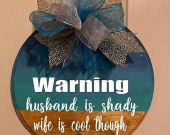 Warning hausnad is shady, wife is cool funny door decor.  Coastal blue with large bow doos sign. Year round wreath.