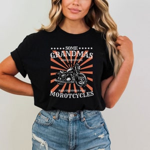 May include: Black t-shirt with a graphic of a motorcycle and the text "Some Grandmas Like Gardening Real Grandmas Ride Motorcycles".