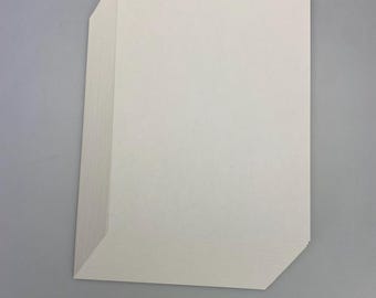May include: A stack of white cardstock paper.