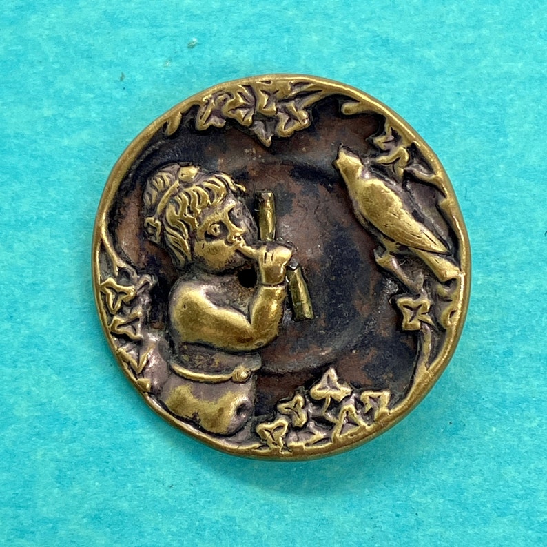Antique Pictorial Brass Button Depicting Child and Bird Whistling