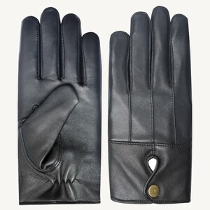 May include: A pair of black leather gloves with a button detail on the cuff.