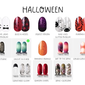 May include: A collection of Halloween-themed nail polish strips featuring various designs including jack-o'-lantern faces, spider webs, glitter, cats, pumpkins, bats, skulls, and floral patterns in colors like black, orange, red, purple, and white.