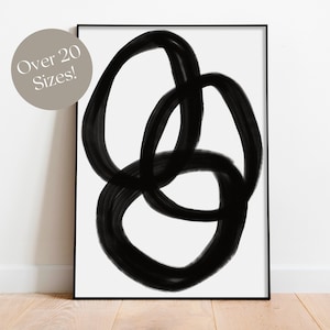 May include: Black and white abstract art print featuring overlapping circles in a minimalist style.