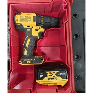 May include: A yellow and black cordless drill and battery pack are stored in a red plastic case. The drill is a DeWalt model, and the battery pack is labelled 20V XR 4AH.
