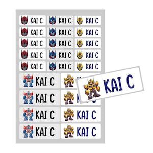 May include: A sheet of white labels with a Transformers theme. The labels feature images of Optimus Prime and Bumblebee. The labels are printed with the name "Kai C" in blue text.