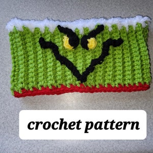 May include: Green crochet headband with a white fuzzy trim and a red bottom edge. The headband features a black and yellow Grinch face.