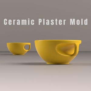 May include: Two yellow ceramic plaster molds. The larger bowl-shaped mold has a curved handle. The smaller mold is in the background. The text "Ceramic Plaster Mold" is at the top of the image.