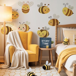 May include: A child's bedroom with a yellow and white color scheme. The room features a yellow armchair, a wooden bed, and a rug with a honeycomb pattern. Bee-themed wall decals and plush toys add to the playful decor. A floor lamp and a side table with a book complete the scene.