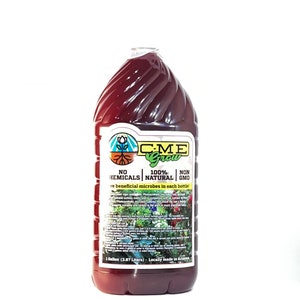 May include: A clear plastic bottle filled with a dark red liquid. The label reads "C-M-E Grow" and states "No Chemicals" and "100% Natural." The bottle contains 1 gallon (3.87 liters) of product.