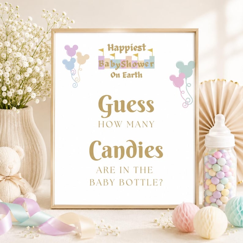 May include: A framed sign with the text "Happiest Baby Shower On Earth" and "Guess How Many Candies Are In The Baby Bottle?". The sign has a gold frame and is decorated with pastel-colored balloons and a baby bottle filled with candies.