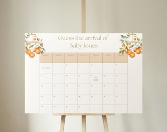 May include: A white calendar with a peach background and orange floral accents. The calendar is titled "Guess the arrival of Baby Jones" and has the month of August displayed. The due date is marked on the calendar.