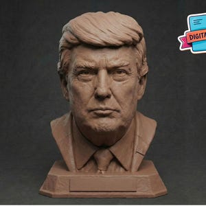 May include: A brown bust sculpture of a man with short, styled hair, a suit jacket, and a tie. The sculpture is on a rectangular base with a blank nameplate. A sticker in the upper right corner reads "DIGITAL FILE".