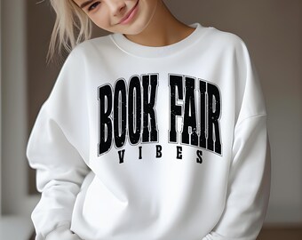 Diseño de camiseta para recaudación de fondos escolares con temática de feria del libro (SVG PNG).