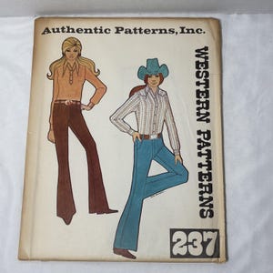 May include: Vintage sewing pattern titled "Authentic Patterns, Inc. Western Patterns 237." The cover features illustrations of two women in Western-style clothing: a button-down shirt and bell-bottom pants. The color palette includes brown, blue, and white.