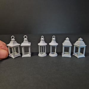 May include: A handcrafted wooden sign, painted white with a distressed finish, bearing the text "Welcome to our home" in a handwritten font. It has a dark brown border and a small heart decoration. Ideal for a front door.