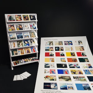 May include: A white miniature magazine rack with multiple shelves filled with miniature magazine covers. The rack is next to a white sheet of paper with a grid of miniature magazine covers. The text "Magazine Covers" is printed at the top of the sheet. The text "Recommended print settings: Use 'Actual Size' and not 'Fit to page'" is printed at the bottom of the sheet.