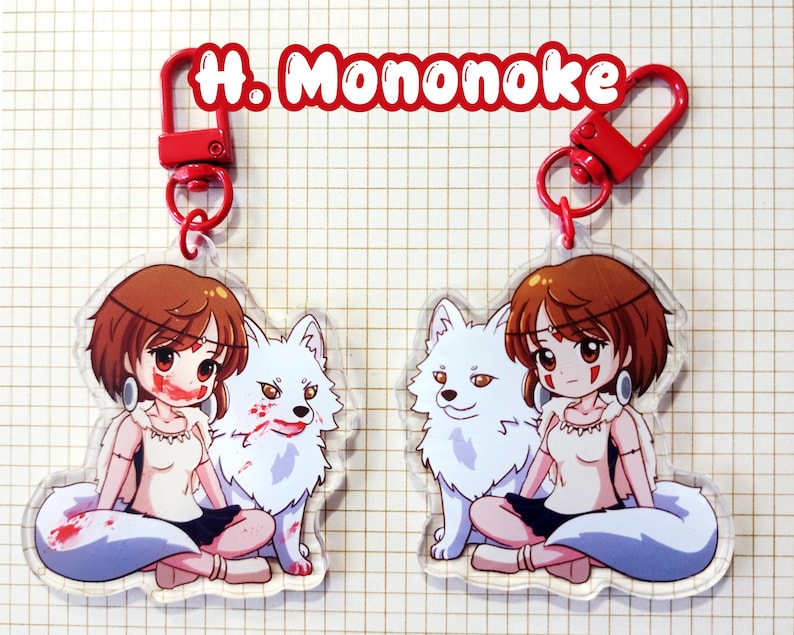 May include: Two clear acrylic keychains featuring a cartoon girl with brown hair and a white wolf. The girl has red accents on her face and is wearing a white top and black skirt. The keychains have red clasps and the text "H. Mononoke" in red.