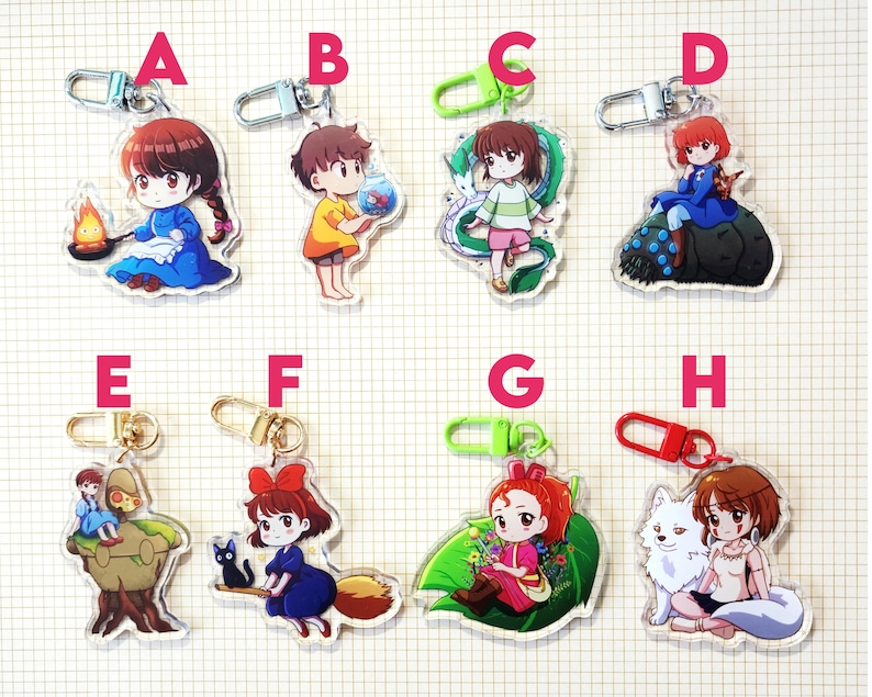 May include: Collection of anime-style acrylic keychains featuring various characters. Each keychain has a different character design, with vibrant colors and detailed artwork. The keychains have metal clasps for easy attachment to bags or keys.