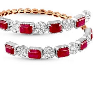 May include: A two-strand bracelet with alternating red rectangular and round white gemstones. The bracelet has a rose gold and silver finish, with a delicate design. The gemstones are set in a silver metal.
