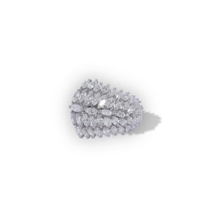 May include: A dazzling, silver-toned ring featuring a cluster of marquise-cut gemstones. The gemstones are arranged in a layered, organic pattern, creating a sparkling, eye-catching design. The ring is set against a white background, highlighting its brilliance.