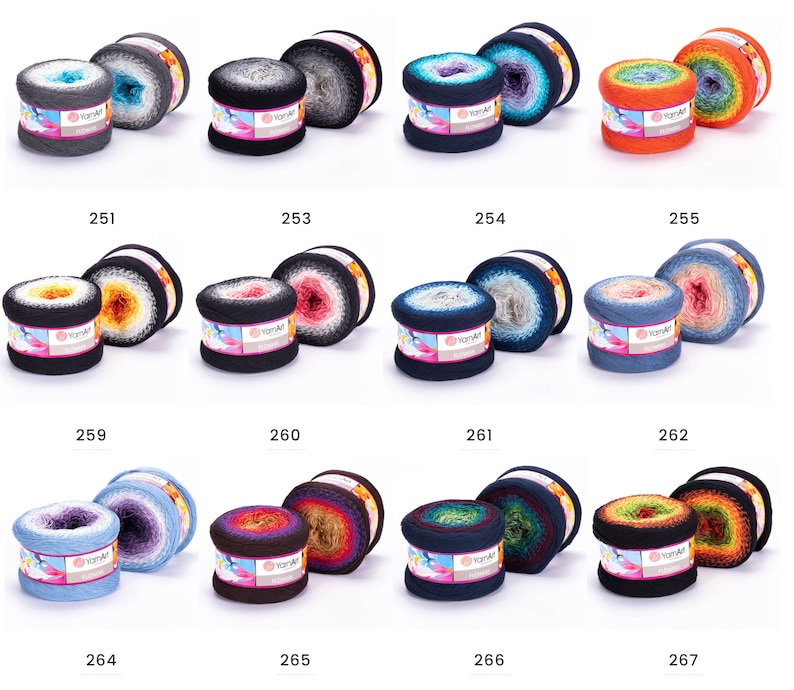 May include: Assortment of yarn balls in various color combinations, including grey, blue, orange, and brown. Each ball has a label with the text "YarnArt" and a number.