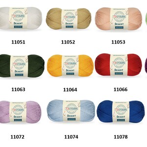 May include: A collection of 12 skeins of yarn in various colors, including white, beige, green, yellow, red, purple, pink, lavender, blue, and light blue. Each skein has a label that reads "TRYARN DESERT". The skeins are arranged in three rows of four. The numbers 11050, 11051, 11052, 11053, 11058, 11060, 11063, 11064, 11066, 11067, 11070, 11072, 11074, 11078, and 11079 are printed below each skein.