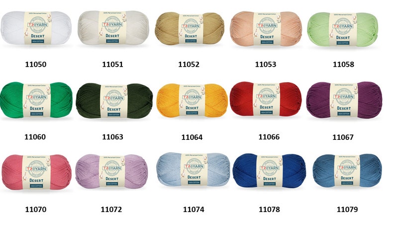 May include: A collection of 12 skeins of yarn in various colors, including white, beige, green, yellow, red, purple, pink, lavender, blue, and light blue. Each skein has a label that reads "TRYARN DESERT". The skeins are arranged in three rows of four. The numbers 11050, 11051, 11052, 11053, 11058, 11060, 11063, 11064, 11066, 11067, 11070, 11072, 11074, 11078, and 11079 are printed below each skein.