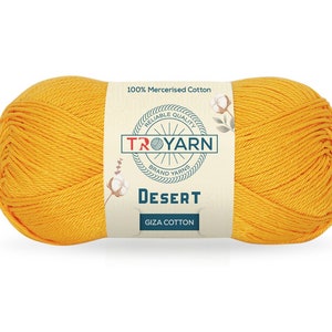May include: A ball of yellow mercerized cotton yarn labeled "TROYARN" with the words "Reliable Quality Brand Yarns" and "Desert Giza Cotton".