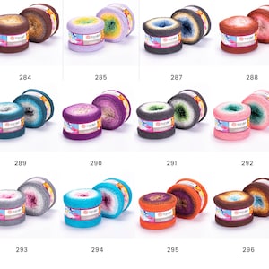 May include: Twelve skeins of ombre yarn in various colors, including brown, purple, teal, pink, gray, blue, orange, and white. Each skein is labeled "YarnArt"