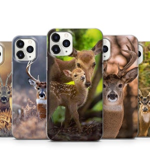 May include: Four different phone cases featuring images of deer. The cases are all clear and display the phone's camera lens. The deer are all in various colours and have different patterns.