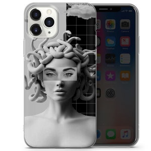 May include: A clear phone case featuring a black and white image of a woman with snakes for hair. The woman's eyes are covered by a white rectangle with the word "Medusa" printed on it.