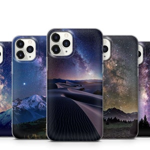 May include: Five different phone cases with a galaxy and night sky design. The cases are all clear and show the design through the back of the case.