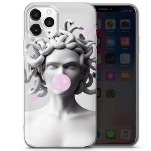 May include: A clear phone case featuring a black and white image of Medusa with pink bubble gum. The image is a modern interpretation of the Greek myth.