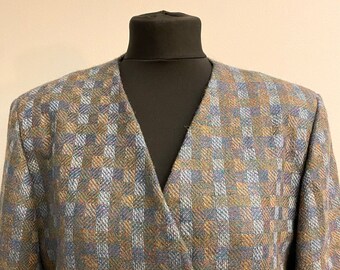 Donkergroen vintage blazerjack met verschillende groen gekleurde details