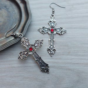 Large gothic cross earrings: antique silver-colored jewelry with red or black rhinestones.
